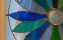 Bespoke stained glass pilchard press wheel window; the cottageīs namesake!