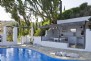 Well-equipped summer kitchen with open BBQ