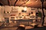Well-equipped summer kitchen with open BBQ